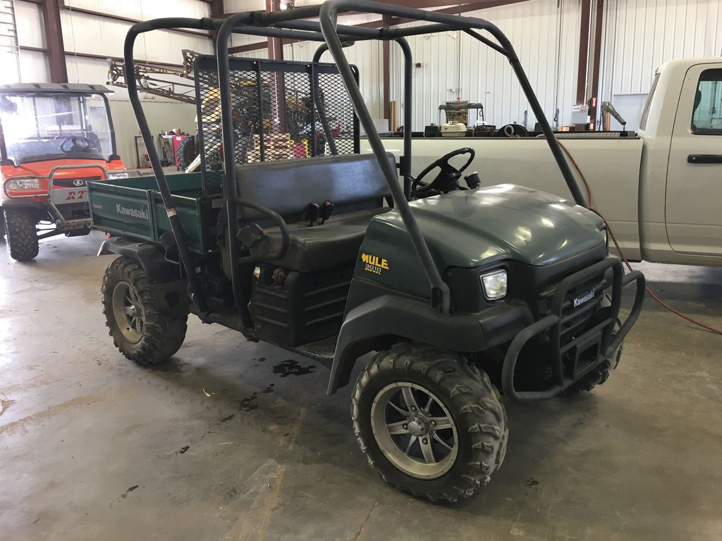 Used green 2005 Kawasaki Motors Corp Mule 3010 UTV in garage. 